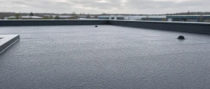 Clean single ply commercial flat roof after rain